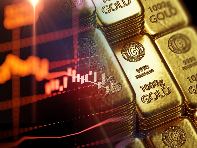 Lingots d’or empilés sur fond sombre, symbole de richesse, de sécurité financière et de capital à long terme.